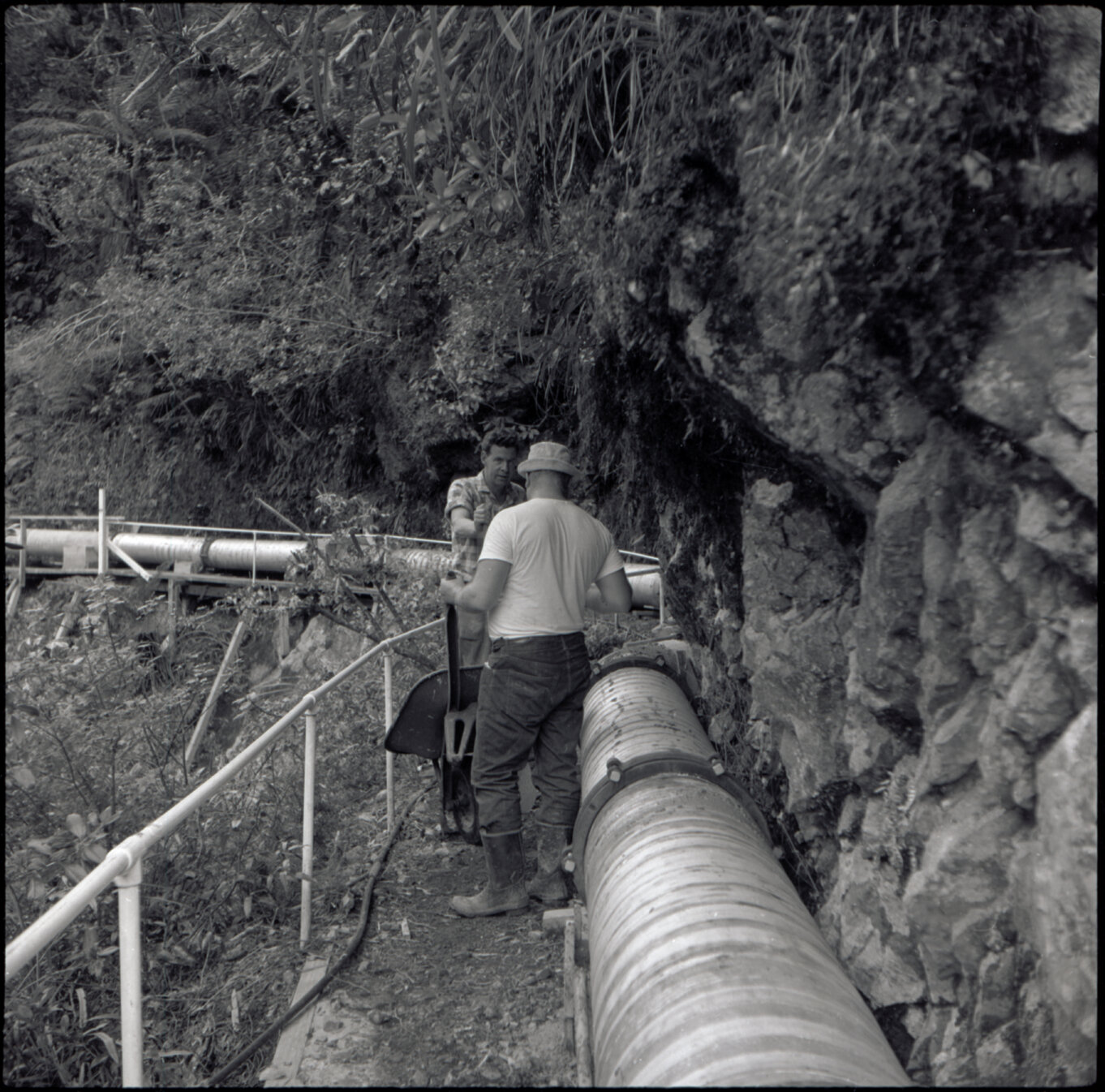 Orongorongo and Wainuiomata water catchment area, pipes and workers