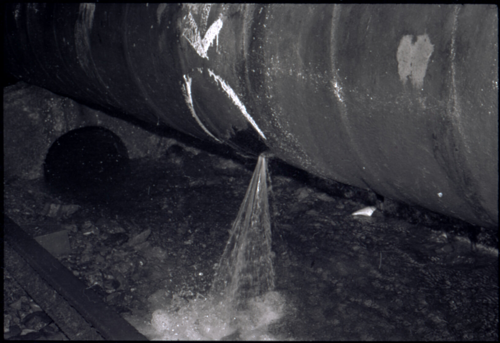 Orongorongo and Wainuiomata water catchment area, close up of pipe with a leak