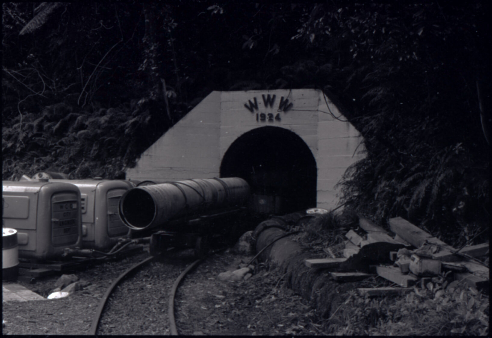 Orongorongo and Wainuiomata water catchment area, WWW 1924 tunnel entrance with pipes