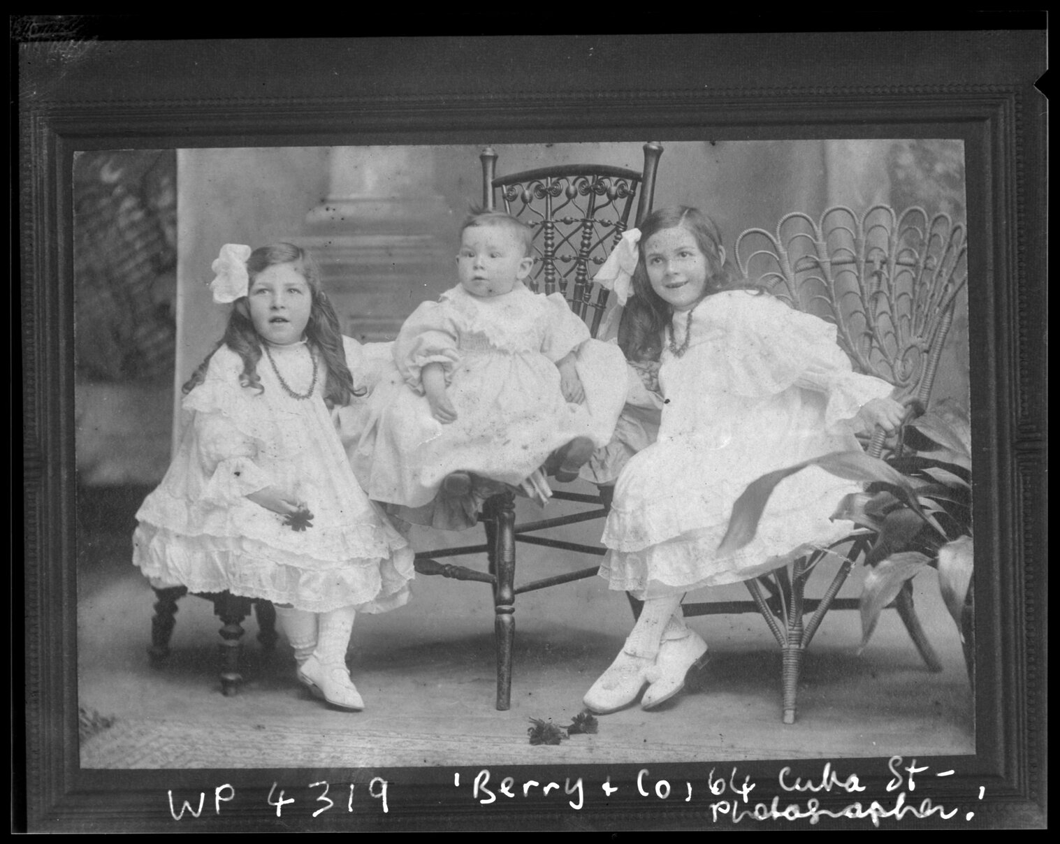 Studio portrait of three children