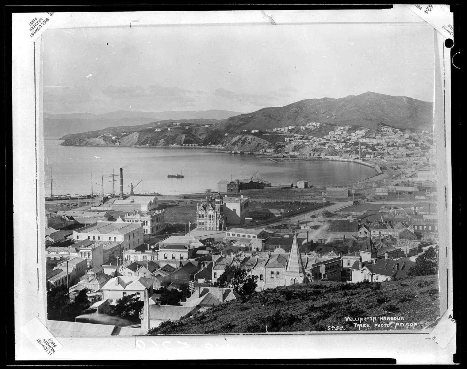 Elevated view of Wellington harbour and first Wellington Public Library