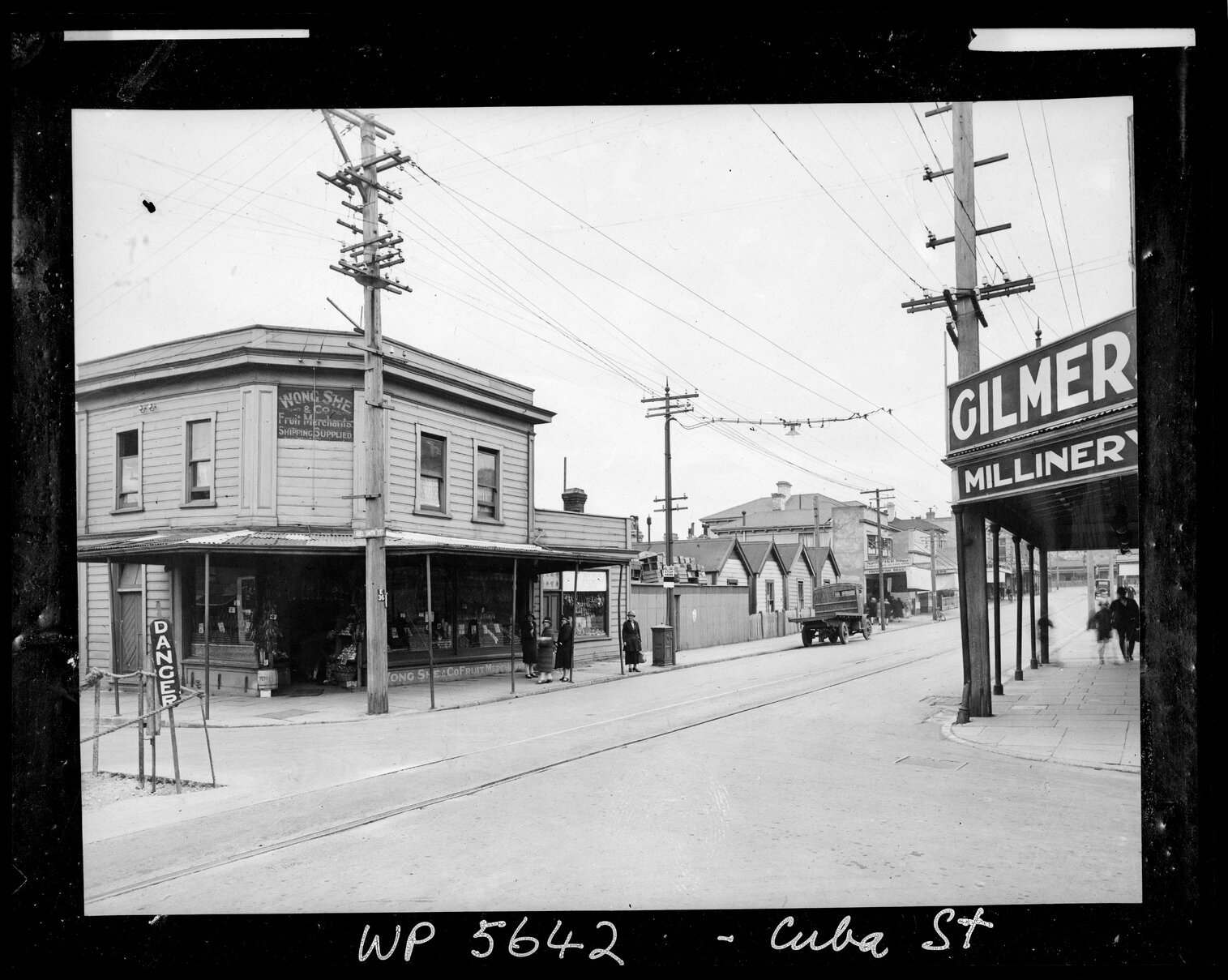 Wong She and Co Fruit Merchants and Gilmers Millinery on the corner of Abel Smith Street and Cuba Street