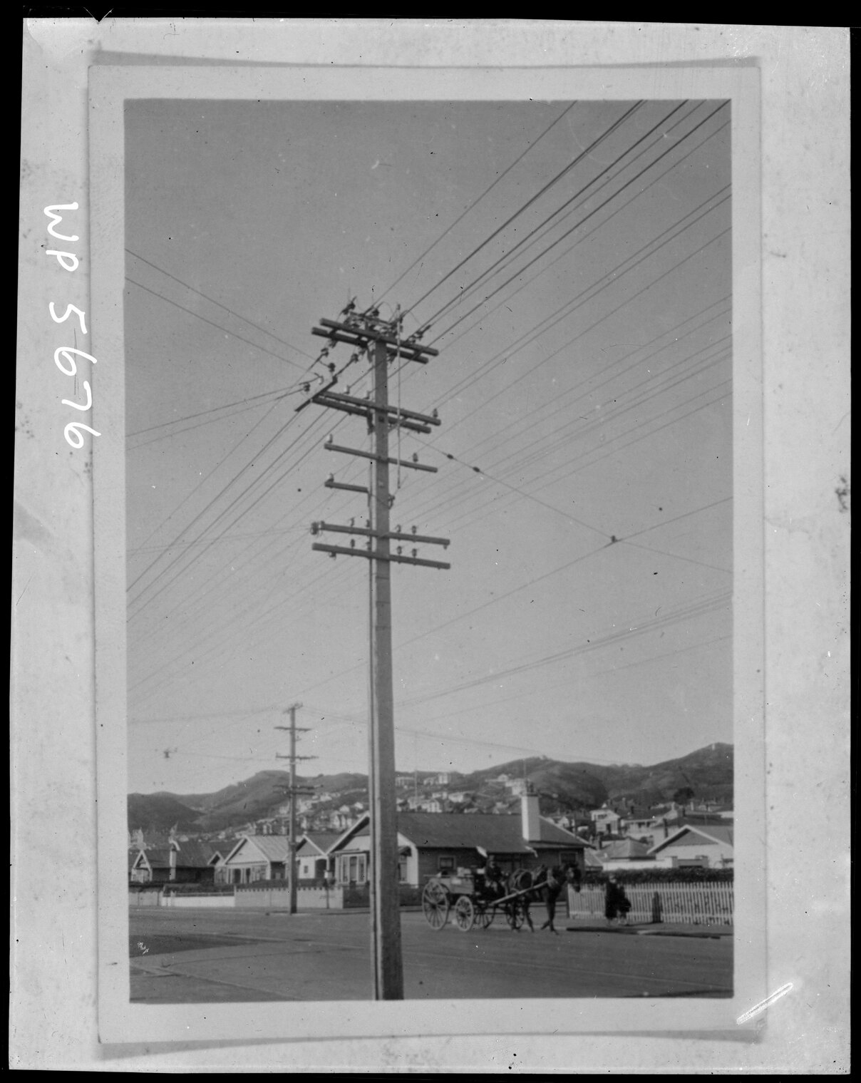 Horse and cart in residential area.