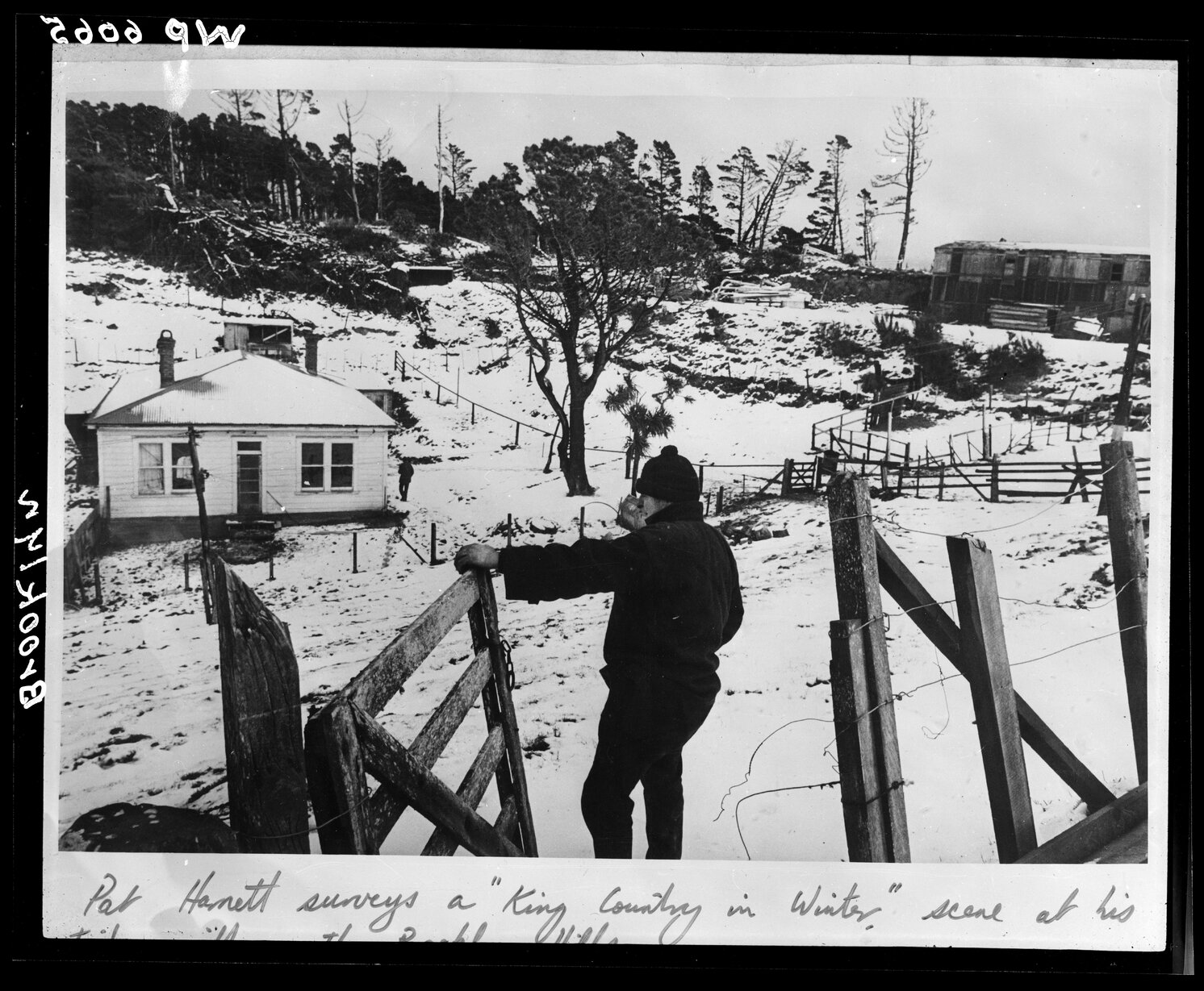 Pat Harnet surveys his timber mill in winter, Brooklyn Hill