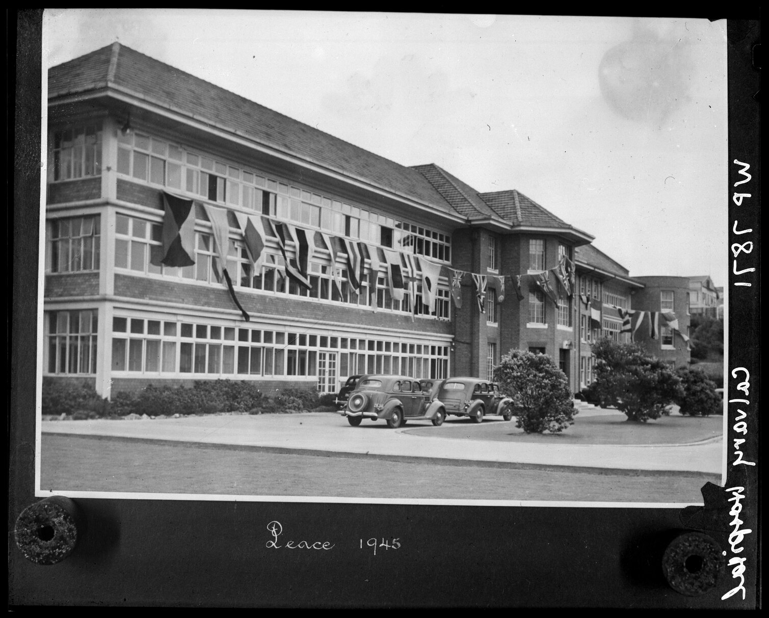 Exterior of the Calvary Hospital decorated with flags to celebrate Peace, Florence Street, Newtown