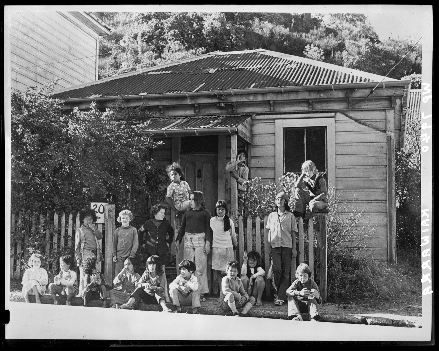Kaiwharawhara School children gathered outside house
