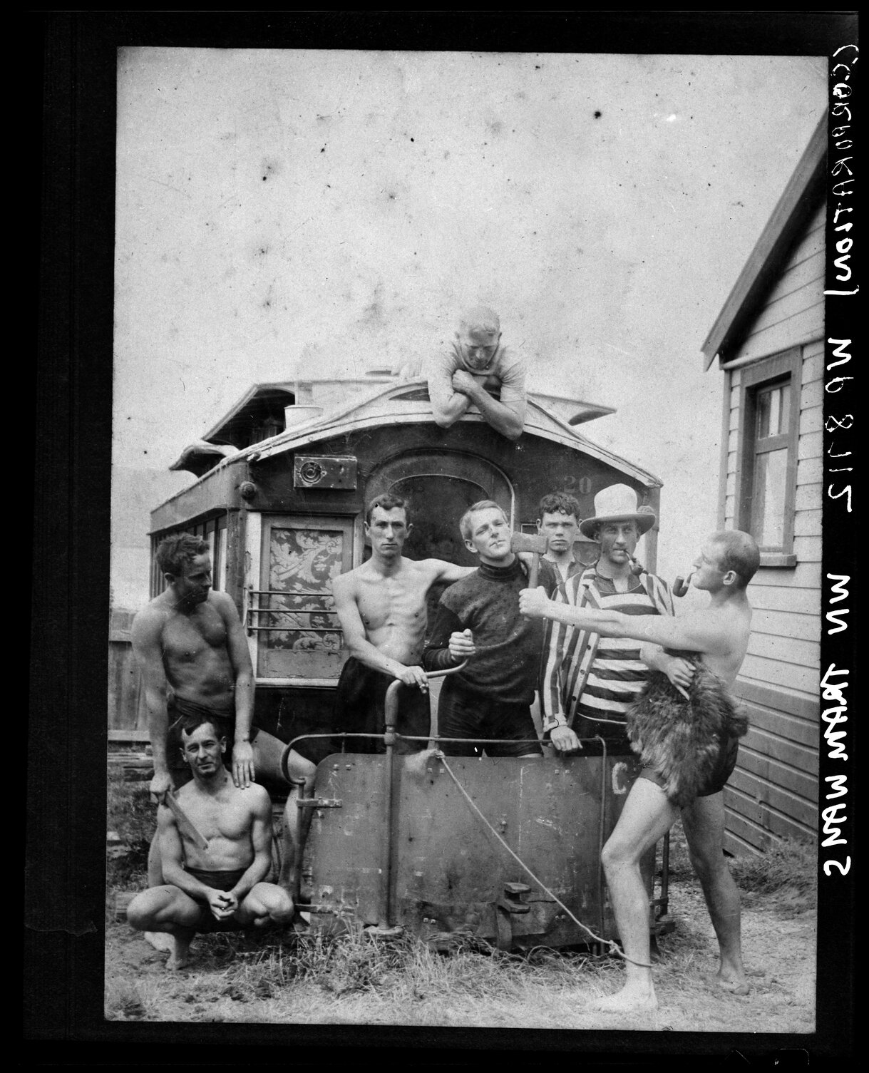 Clowning around in front of old horse tram