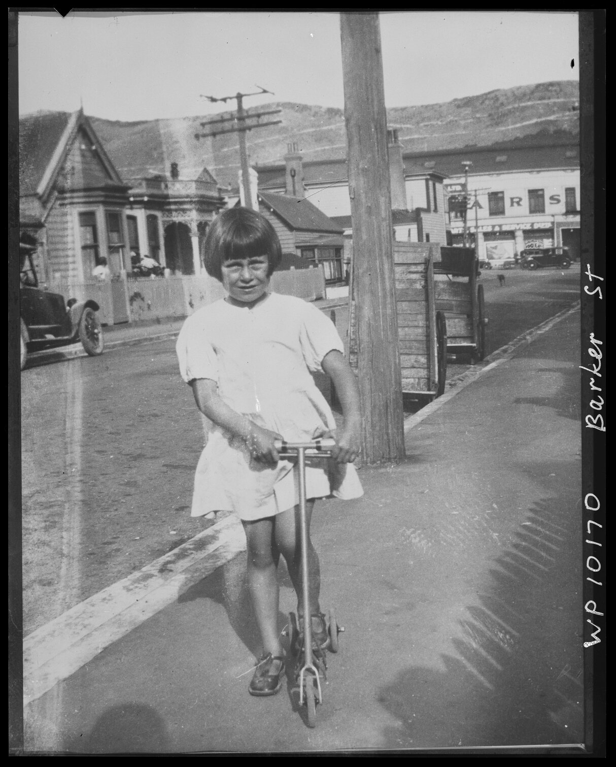 Girl on scooter, Barker Street