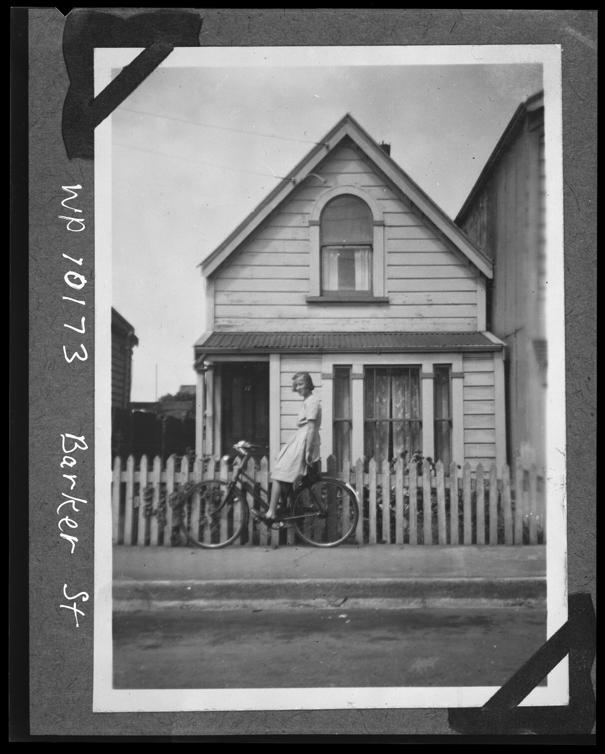 Girl (June Brown) on bicycle, 17 Barker Street