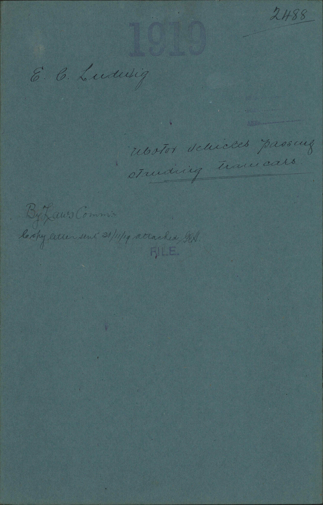 Motor vehicles passing standing tramcars - E C Ludwig