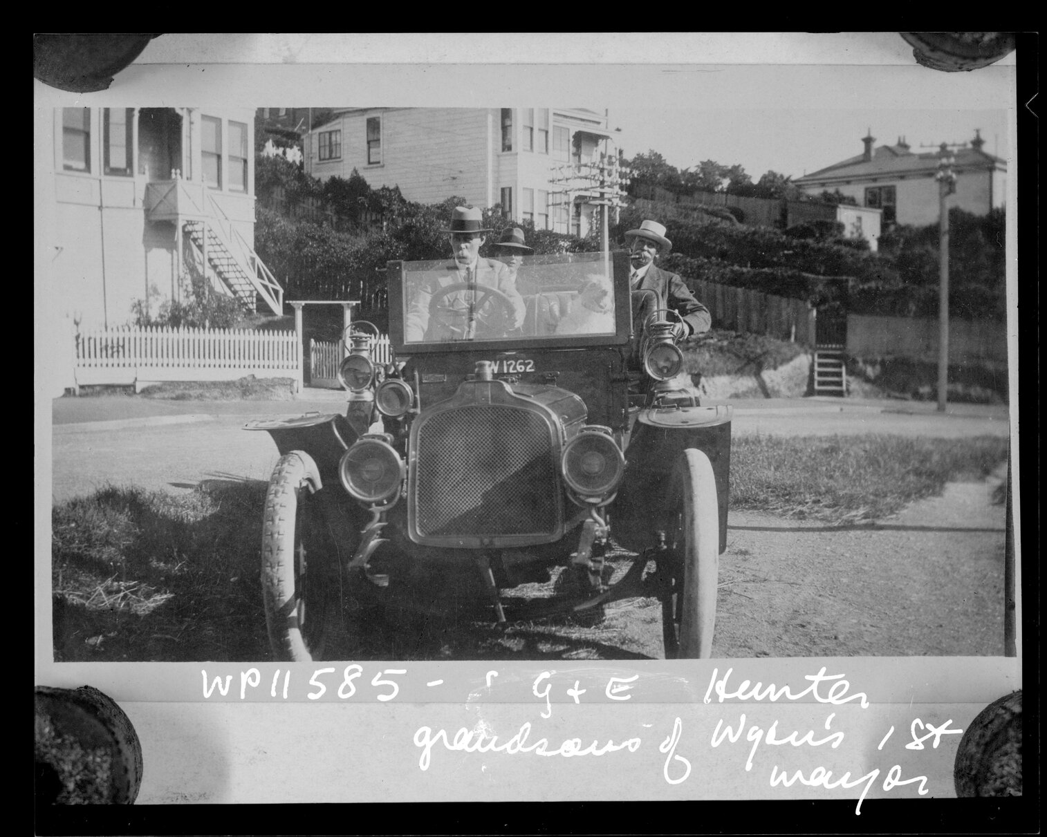 G and E Hunter, grandsons of the first Mayor of Wellington, sitting in an open-topped motor vehicle