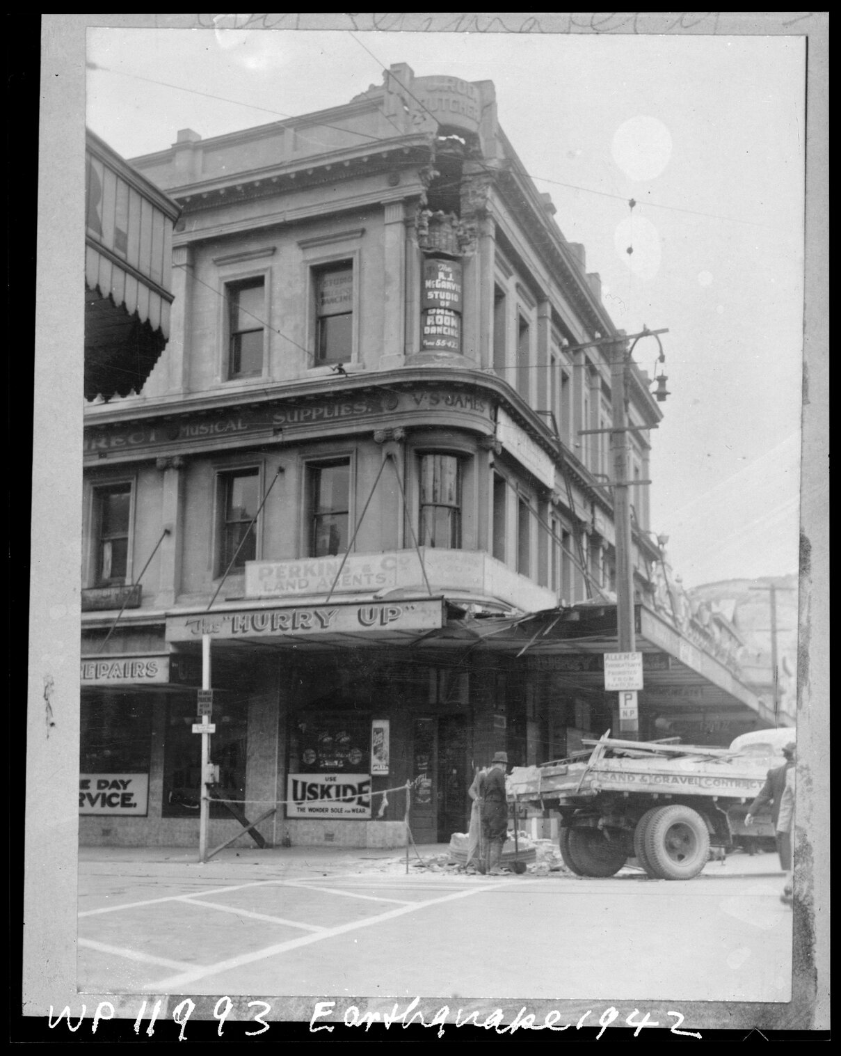 West corner of Allen Street and Courtenay Place [30-36 Courtenay Place], damage by earthquake being cleared away