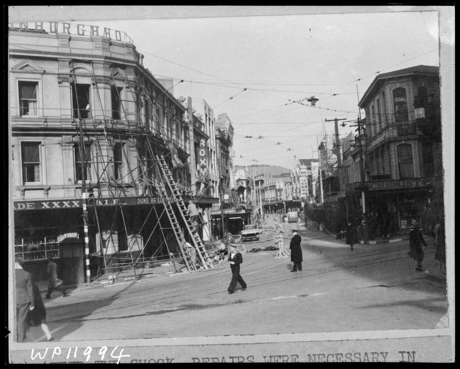 Corner of Willis Street and Manners Street, repairing earthquake damage