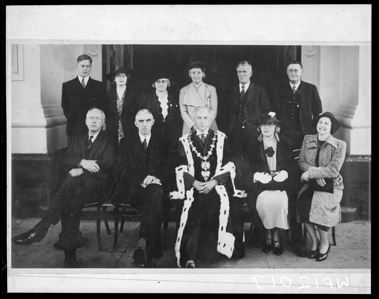 Mayor and committee members, Mayor T C Hislop wearing mayoral robes and chain