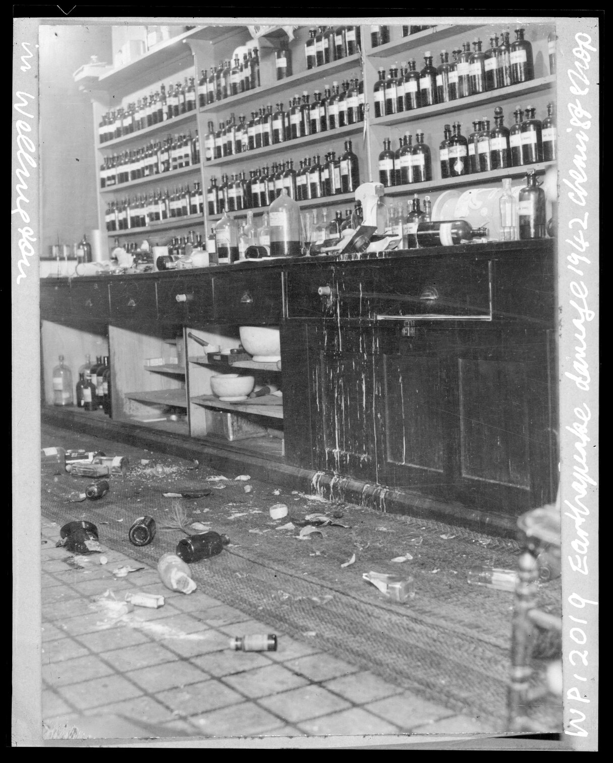 Interior of chemist's shop showing damage by 1942 earthquake