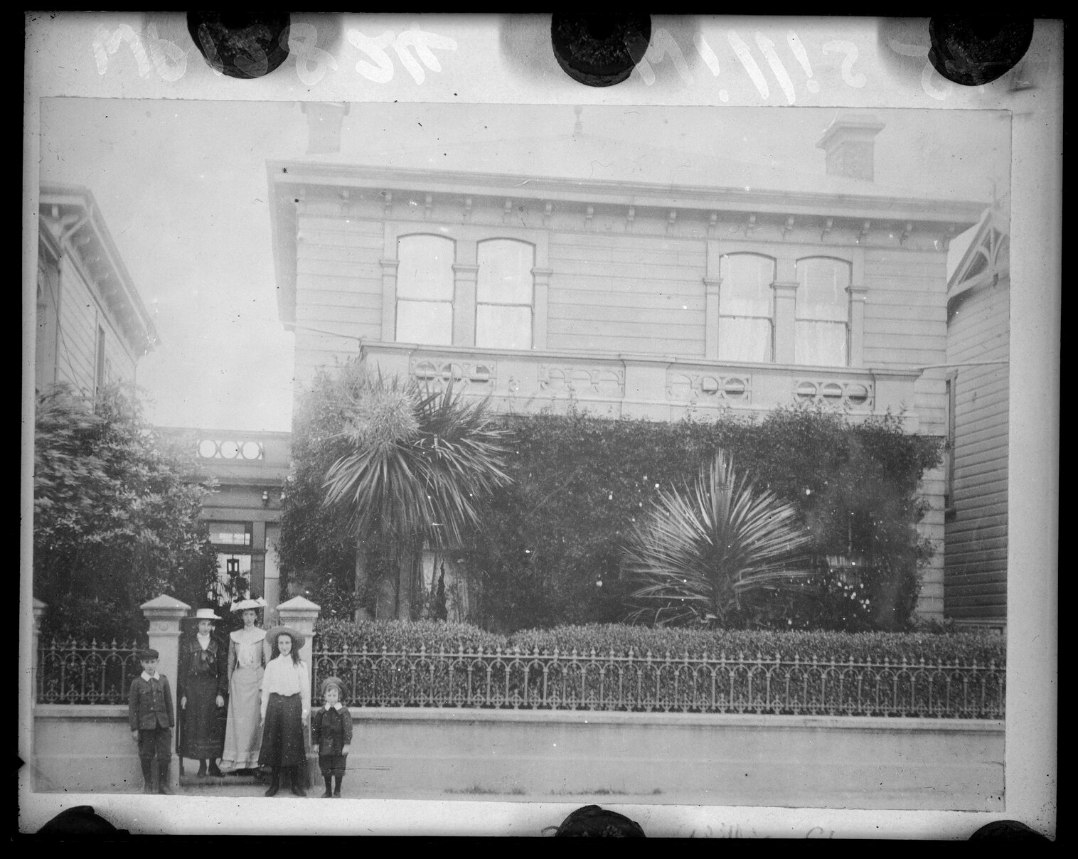 Group of people standing in front of 323 Willis Street