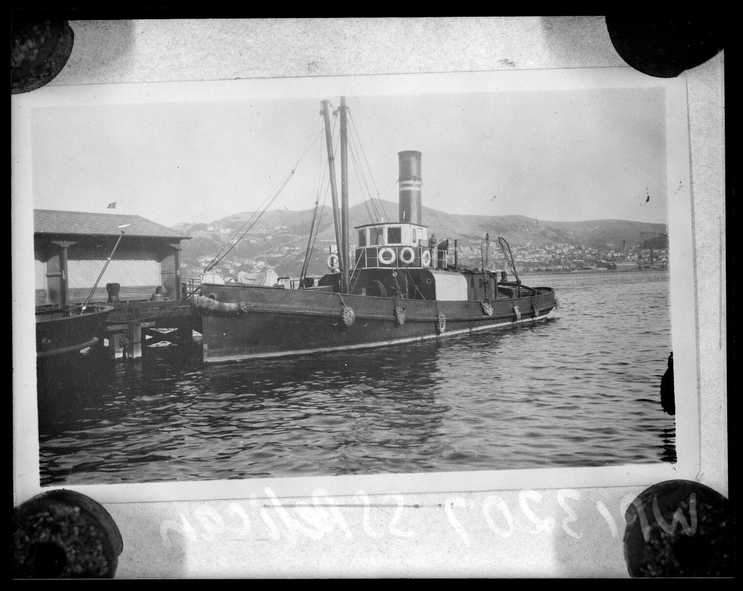 Ship, '' S T Pelican '', moored at wharf