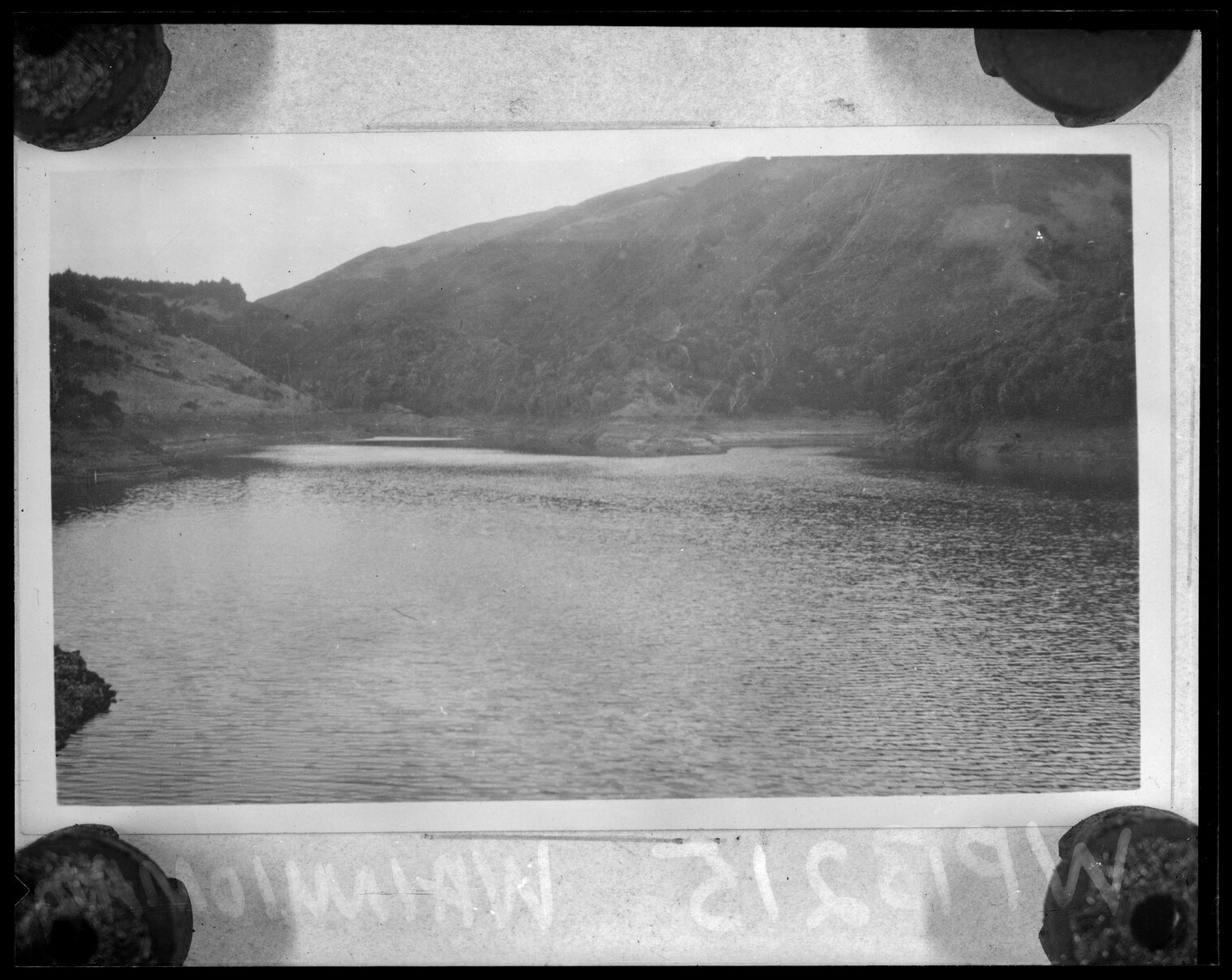 Wainuiomata, upper dam from dam wall showing water and surrounding hills