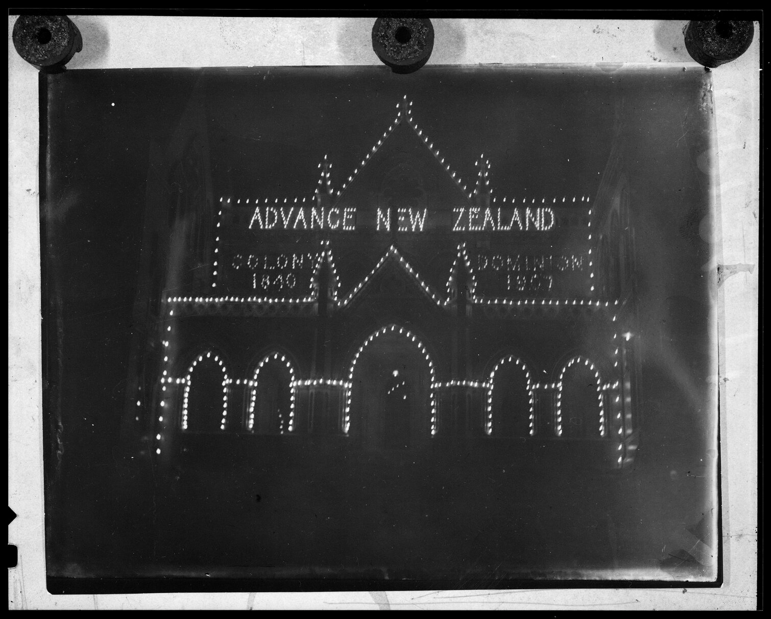 Parliament Buildings illuminated at night to celebrate Dominion Day