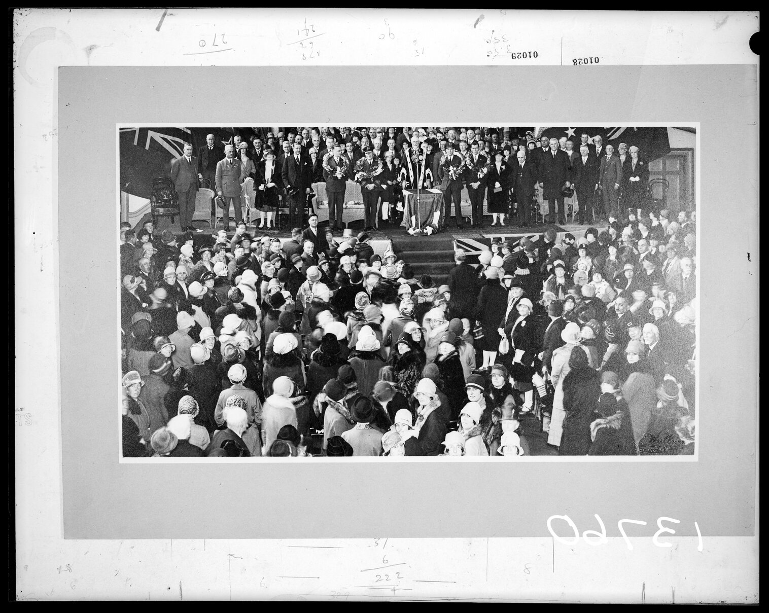 Mayor and dignitaries on stage, including J.G.Coates and G.W.Forbes - presentation to two men in uniform.