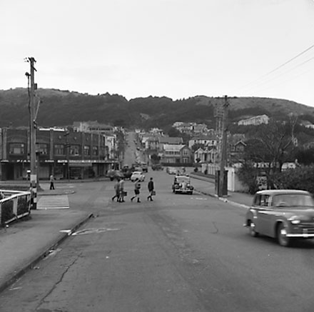 a. Intersection of Ellice Street and Cambridge and Kent Terrace, school boys crossing road, motor vehicles, Basin Reserve on the right, Baltimore Milk Bar