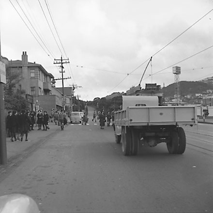 b. Tram stopped outside Saint Marks Church School, truck in foreground, schoolchildren 