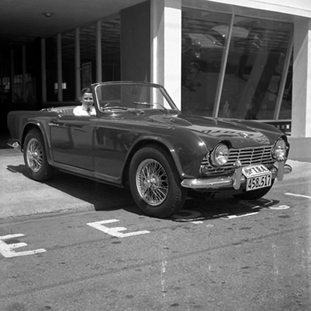 a. Triumph TR4 sportscar parked outside Amuri Motors