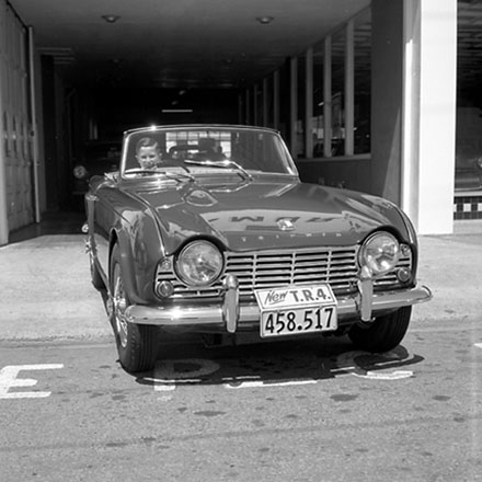 b. Traffic Department, Traffic Officer with man in sportscar.