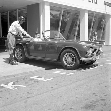 c. Traffic Department, Traffic Officer with man in sportscar.