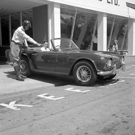 d. Traffic Department, Traffic Officer with man in sportscar.