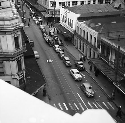 a. Elevated view of Cuba Street from James Smith Corner. Royal Oak Hotel on the left. Woolworths Building on the corner of Dixon Street. Motor vehicles
