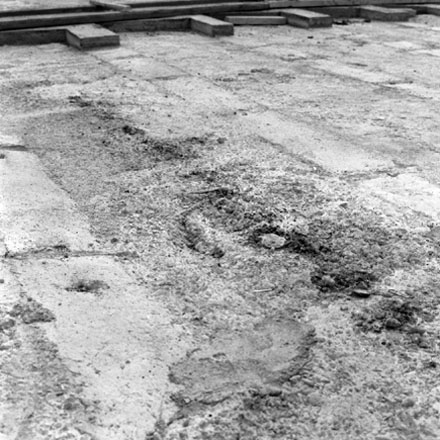 l. Construction of new bridge, workmen, machinery, motor vehicles. Road is being resurfaced