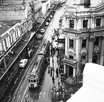 a. Elevated view of Cuba Street from James Smith Corner. Royal Oak Hotel on the left. Woolworths Building on the corner of Dixon Street. Motor vehicles