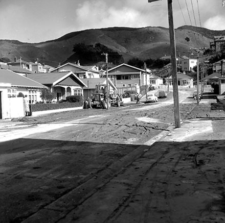 d. View from Dee Street. The debris is being cleared away with a grader
