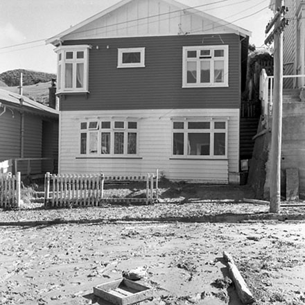 e. Front yards of a dwelling damaged by storm debris