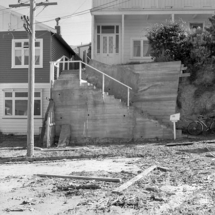 f. Front yards of a dwelling damaged by storm debris