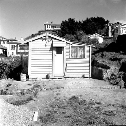 b. Views of small, single storey wooden dwelling, ' said to be the first house in Vogeltown '