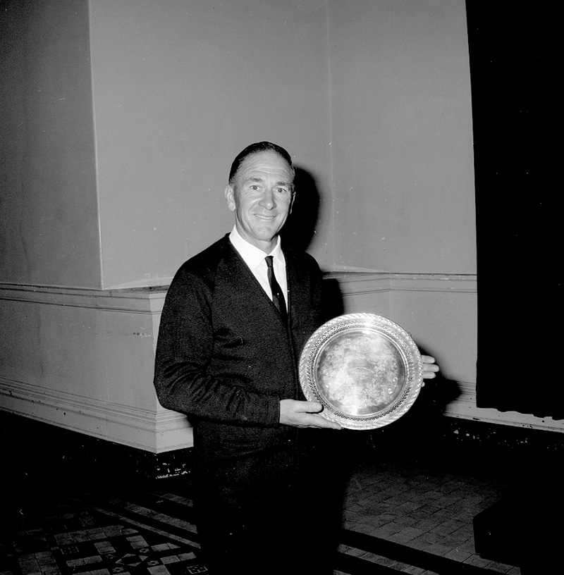 b. Kel Baker and Golf Trophy