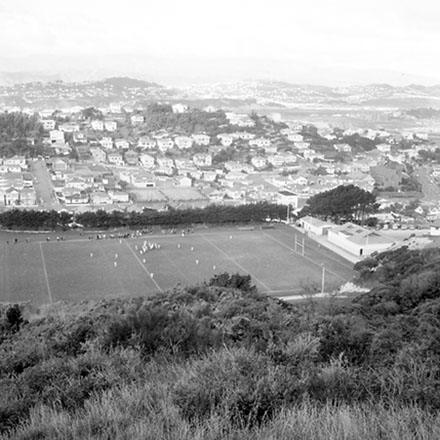 f. Elevated view of playing fields, rugby game in progress