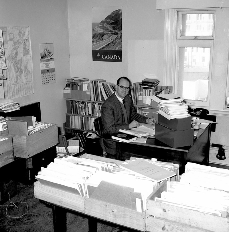 b. George Betts, author, at desk