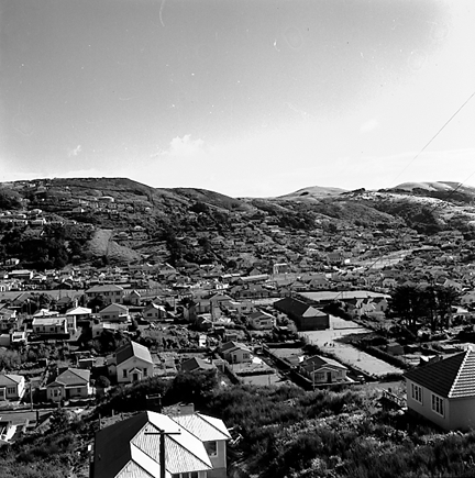 b. elevated views of residential area, Saint Bridgid's School in the background