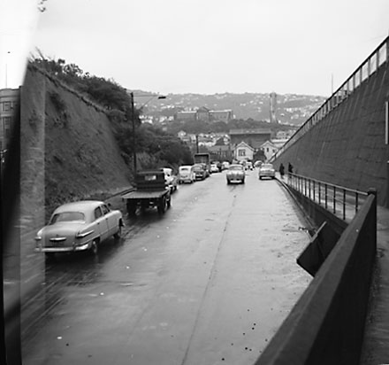 a. City side of Mount Victoria tunnel, moving traffic and parked motor vehicles