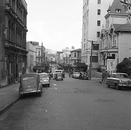 a. From the south end of Boulcott Street, looking towards the Manners and Willis Street intersection. Boulcott Chambers building on the left, YWCA and the St George Hotel on the right. Motor vehicles