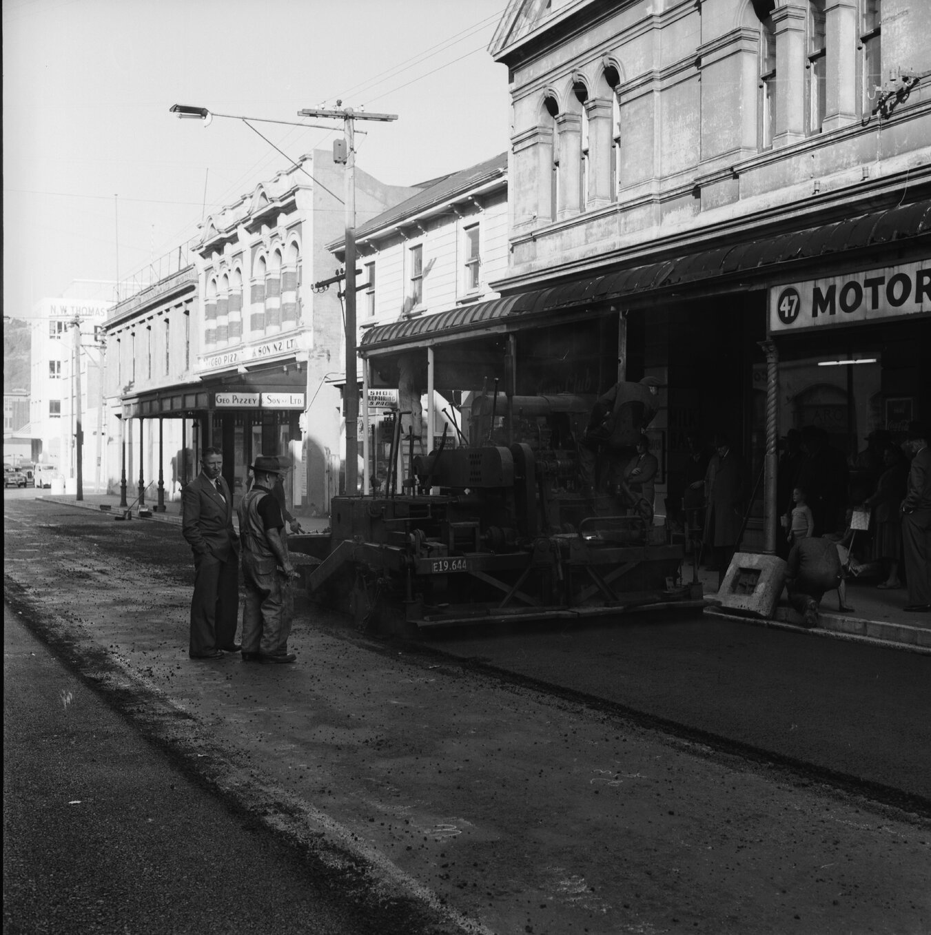 d. Looking east from Cuba Street corner to Marion Street, Union Clothing Company, 47 Ghuznne Street Motor Supplies