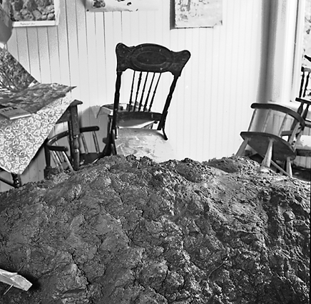 i. Slip in slope above building. Damage to building