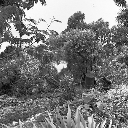 k. Slip in slope above building. Damage to building