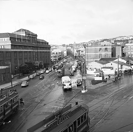 d. Elevated view of Railway Tram Terminus on Thorndon Quay / Featherston Street - people waiting for trams, buses, motor vehicles