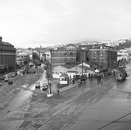 g. Elevated view of Railway Tram Terminus on Thorndon Quay / Featherston Street - people waiting for trams, buses, motor vehicles