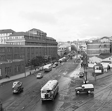 h. Elevated view of Railway Tram Terminus on Thorndon Quay / Featherston Street - people waiting for trams, buses, motor vehicles
