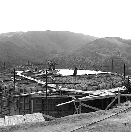 a. Workmen constructing reservoir